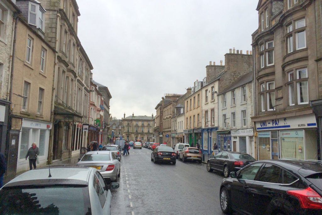 High Street, Hawick, with the shops and takeaways of the town centre