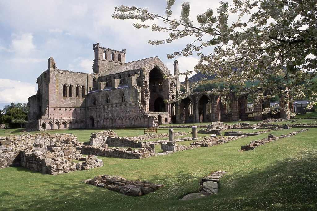Melrose Abbey in spring, with the Eildons behind